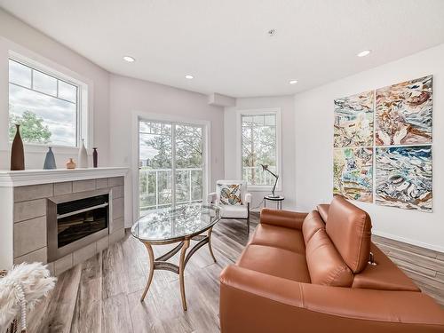 319 12111 51 Avenue, Edmonton, AB - Indoor Photo Showing Living Room With Fireplace