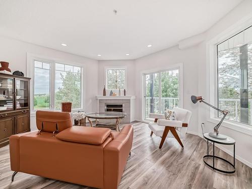 319 12111 51 Avenue, Edmonton, AB - Indoor Photo Showing Living Room With Fireplace