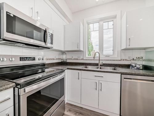 319 12111 51 Avenue, Edmonton, AB - Indoor Photo Showing Kitchen With Stainless Steel Kitchen With Double Sink