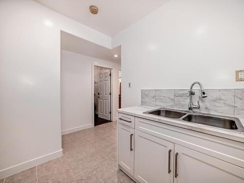 9646 73 Avenue, Edmonton, AB - Indoor Photo Showing Kitchen With Double Sink