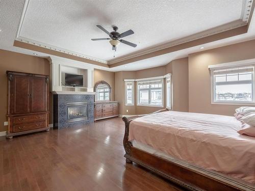 839 Wildwood Crescent, Edmonton, AB - Indoor Photo Showing Bedroom With Fireplace