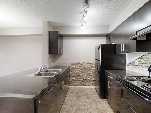 404 1510 Watt Drive, Edmonton, AB - Indoor Photo Showing Kitchen With Double Sink