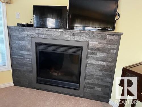 5438 43 Street, Vegreville, AB - Indoor Photo Showing Living Room With Fireplace