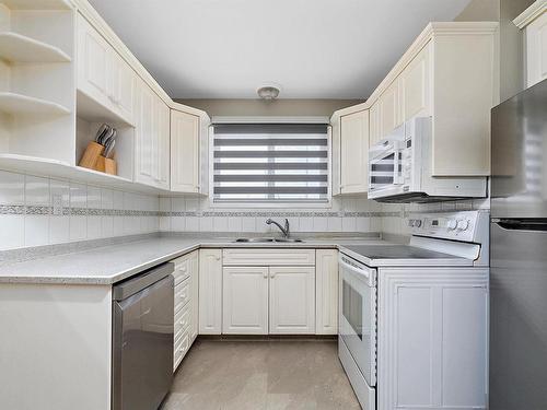 6205 90 Avenue, Edmonton, AB - Indoor Photo Showing Kitchen With Double Sink