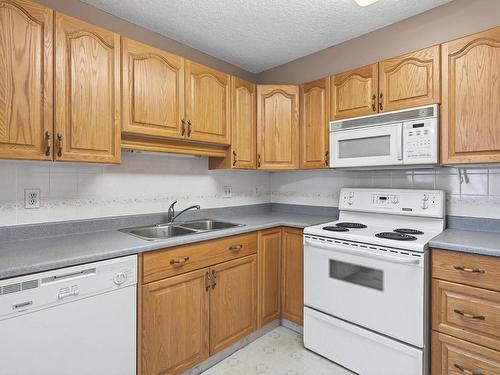 215 17150 94A Avenue, Edmonton, AB - Indoor Photo Showing Kitchen With Double Sink