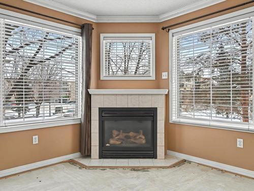 215 17150 94A Avenue, Edmonton, AB - Indoor Photo Showing Living Room With Fireplace