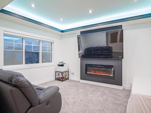 5506 Chegwin Point, Edmonton, AB - Indoor Photo Showing Living Room With Fireplace