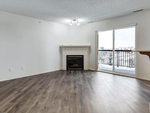 419 2098 Blackmud Creek Drive, Edmonton, AB - Indoor Photo Showing Living Room With Fireplace