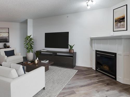 419 2098 Blackmud Creek Drive, Edmonton, AB - Indoor Photo Showing Living Room With Fireplace