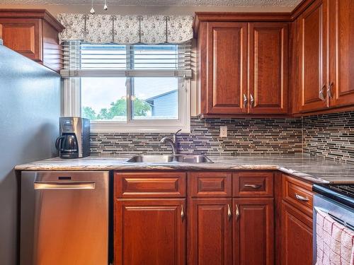 3131 144 Avenue, Edmonton, AB - Indoor Photo Showing Kitchen With Double Sink