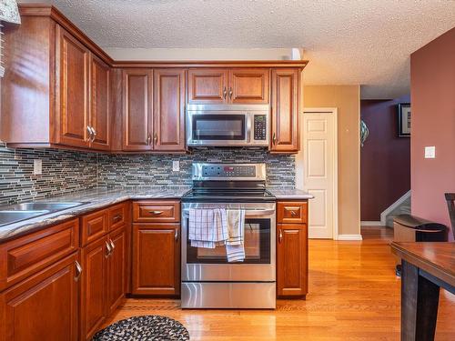 3131 144 Avenue, Edmonton, AB - Indoor Photo Showing Kitchen With Double Sink