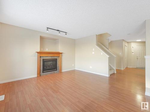 8608 7 Avenue, Edmonton, AB - Indoor Photo Showing Living Room With Fireplace