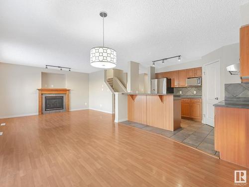 8608 7 Avenue, Edmonton, AB - Indoor Photo Showing Kitchen With Fireplace