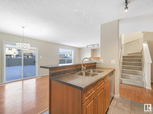 8608 7 Avenue, Edmonton, AB - Indoor Photo Showing Kitchen With Double Sink