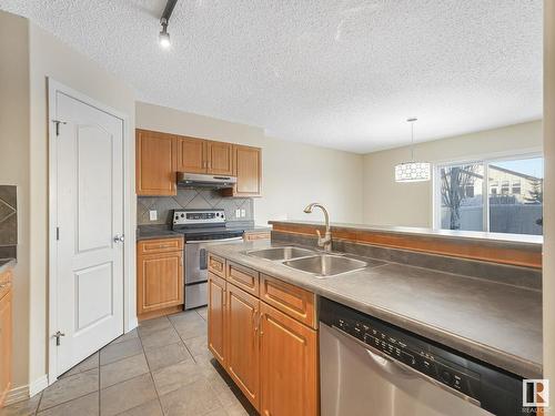 8608 7 Avenue, Edmonton, AB - Indoor Photo Showing Kitchen With Double Sink