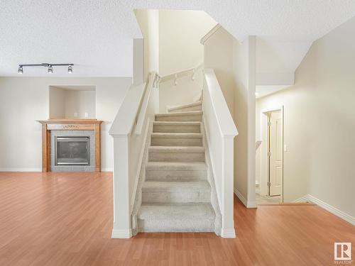 8608 7 Avenue, Edmonton, AB - Indoor Photo Showing Other Room With Fireplace