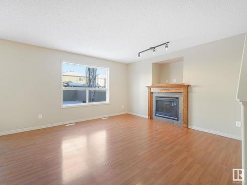 8608 7 Avenue, Edmonton, AB - Indoor Photo Showing Living Room With Fireplace