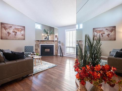 14167 26 Street, Edmonton, AB - Indoor Photo Showing Living Room With Fireplace