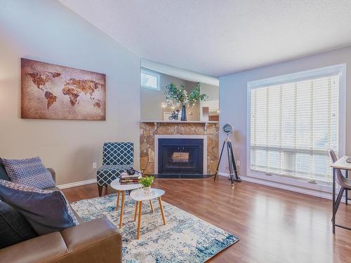 14167 26 Street, Edmonton, AB - Indoor Photo Showing Living Room With Fireplace