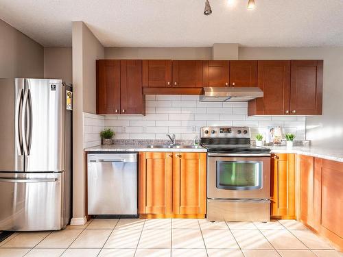 14167 26 Street, Edmonton, AB - Indoor Photo Showing Kitchen With Stainless Steel Kitchen With Double Sink