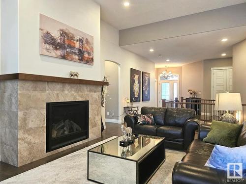 1318 Hainstock Way Sw, Edmonton, AB - Indoor Photo Showing Living Room With Fireplace