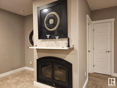 1318 Hainstock Way Sw, Edmonton, AB - Indoor Photo Showing Living Room With Fireplace