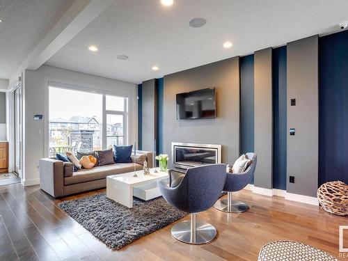 607 Howatt Drive Sw, Edmonton, AB - Indoor Photo Showing Living Room With Fireplace