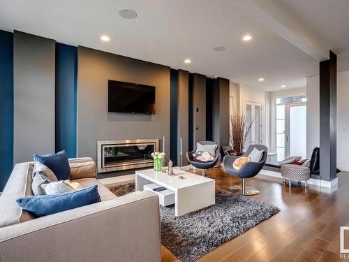 607 Howatt Drive Sw, Edmonton, AB - Indoor Photo Showing Living Room With Fireplace