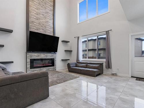 2104 18 Avenue, Edmonton, AB - Indoor Photo Showing Living Room With Fireplace