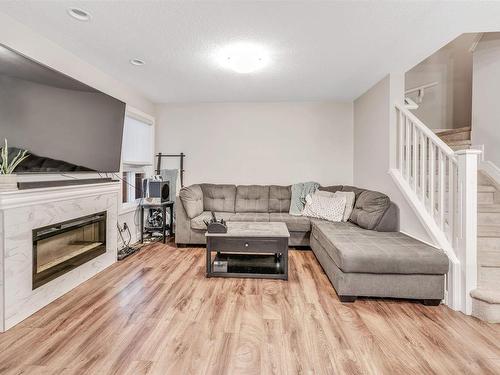 16725 18 Avenue, Edmonton, AB - Indoor Photo Showing Living Room With Fireplace