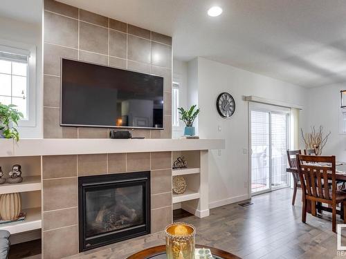 3021 Carpenter Landing Landing, Edmonton, AB - Indoor Photo Showing Living Room With Fireplace