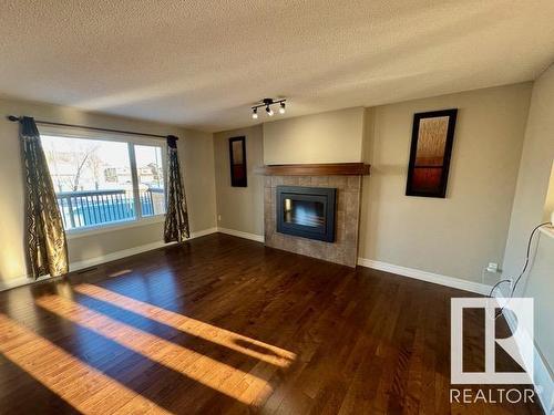 1518 36B Avenue, Edmonton, AB - Indoor Photo Showing Living Room With Fireplace