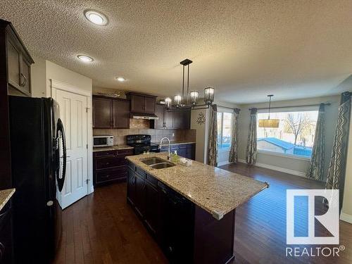 1518 36B Avenue, Edmonton, AB - Indoor Photo Showing Kitchen With Double Sink