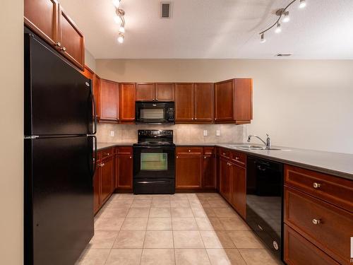 127 160 Magrath Road, Edmonton, AB - Indoor Photo Showing Kitchen With Double Sink