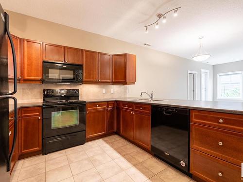 127 160 Magrath Road, Edmonton, AB - Indoor Photo Showing Kitchen With Double Sink