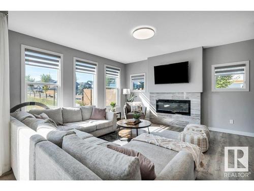 3971 5 Avenue, Edmonton, AB - Indoor Photo Showing Living Room With Fireplace