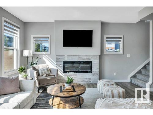 3971 5 Avenue, Edmonton, AB - Indoor Photo Showing Living Room With Fireplace