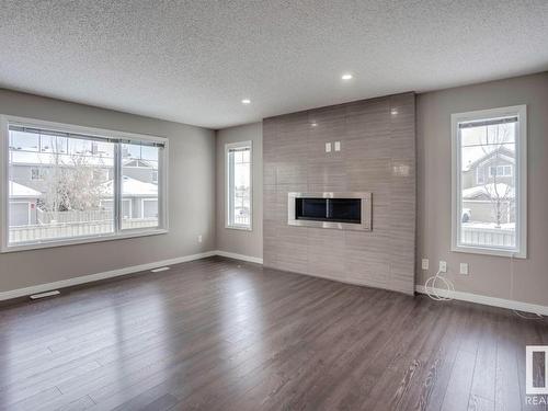 3520 Claxton Crescent, Edmonton, AB - Indoor Photo Showing Living Room With Fireplace