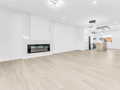 860 Northern Harrier Lane, Edmonton, AB - Indoor Photo Showing Living Room With Fireplace