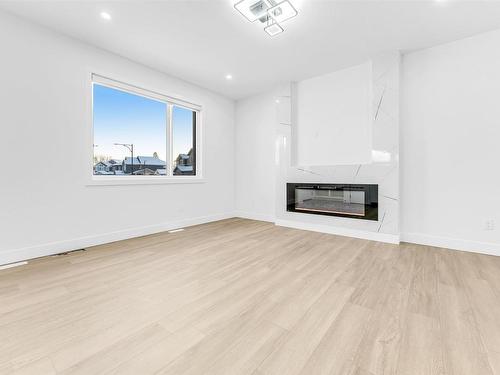 860 Northern Harrier Lane, Edmonton, AB - Indoor Photo Showing Living Room With Fireplace