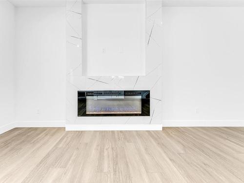 860 Northern Harrier Lane, Edmonton, AB - Indoor Photo Showing Living Room With Fireplace