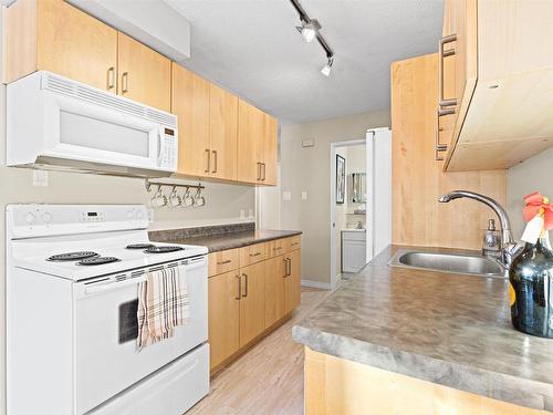 G 16405 89 Avenue, Edmonton, AB - Indoor Photo Showing Kitchen With Double Sink