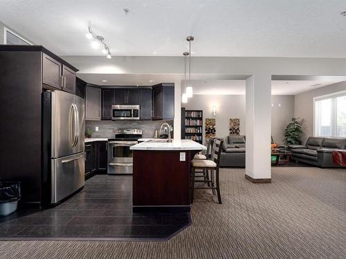 #347 6079 Maynard Way, Edmonton, AB - Indoor Photo Showing Kitchen With Stainless Steel Kitchen With Upgraded Kitchen