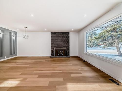 Edmonton, AB - Indoor Photo Showing Other Room With Fireplace