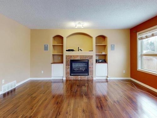 3553 23 St, Edmonton, AB - Indoor Photo Showing Living Room With Fireplace