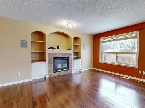 3553 23 St, Edmonton, AB - Indoor Photo Showing Living Room With Fireplace