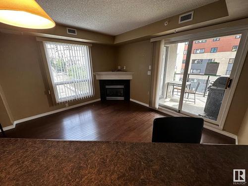 506 9707 106 Street, Edmonton, AB - Indoor Photo Showing Other Room With Fireplace