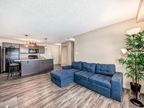 461 1196 Hyndman Road, Edmonton, AB - Indoor Photo Showing Living Room