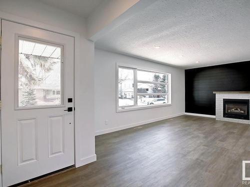 9104 69 Street, Edmonton, AB - Indoor Photo Showing Living Room With Fireplace