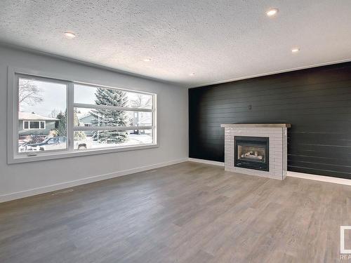 9104 69 Street, Edmonton, AB - Indoor Photo Showing Living Room With Fireplace